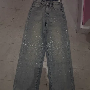 Jeans strass vita bassa
